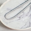 Moissanite Tennis Necklace on marble